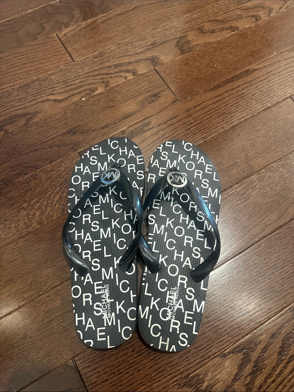 MICHAEL Michael Kors Black and White Logo Flip Flops